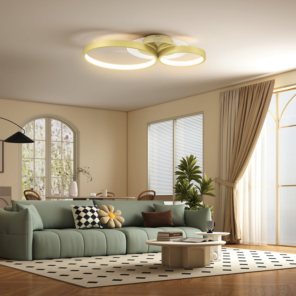 Plafón LED de tres aros dorados en un salón