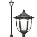 Farola solar de jardín negra con luz LED fría sobre fondo blanco