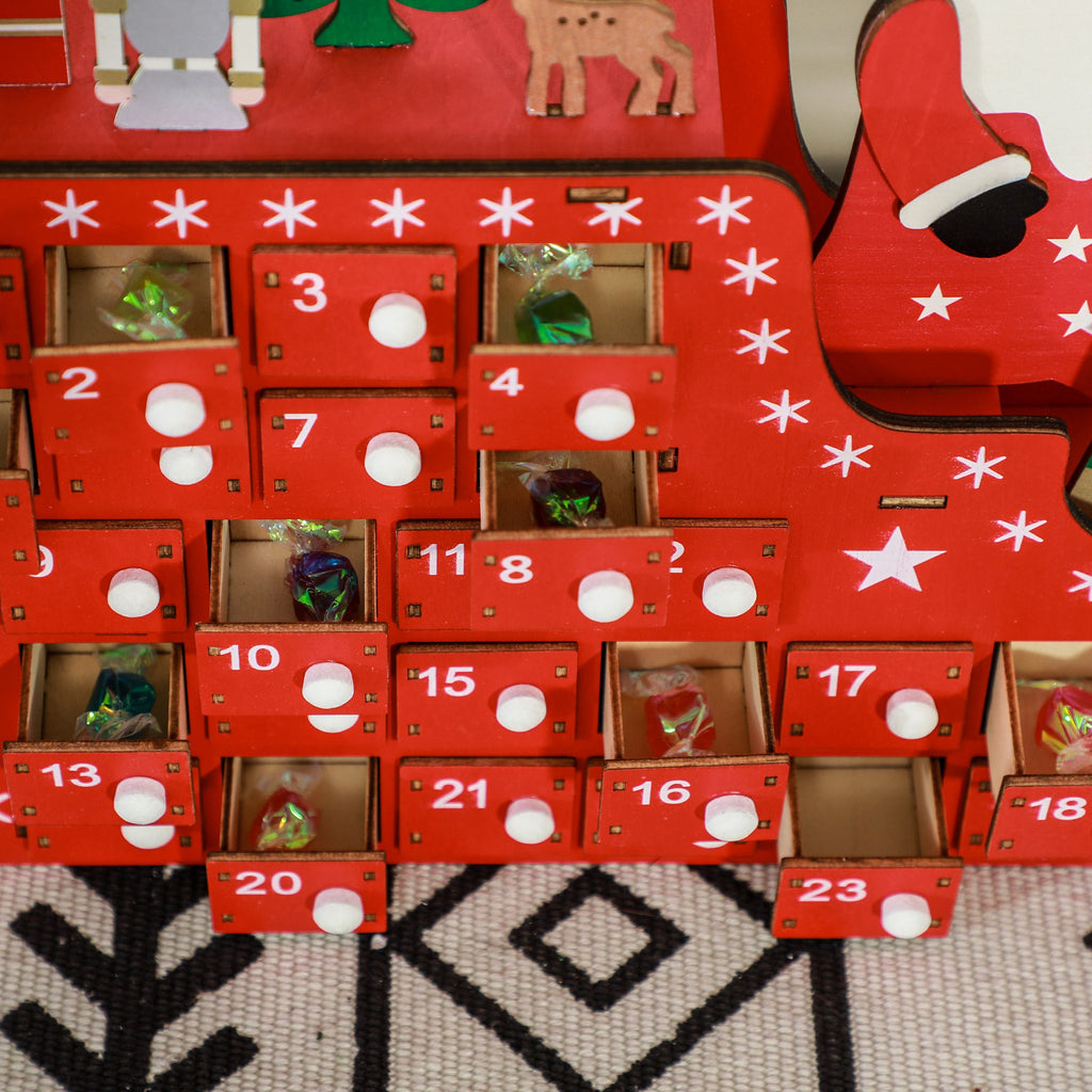 Cajones numerados con tirador blanco y estrellas del calendario de Adviento, con caramelos dentro