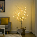 Árbol de abedul luminoso de 150 cm en un salón con un sillón y una alfombra