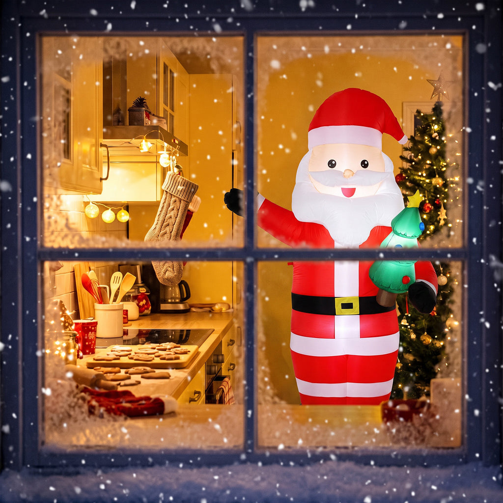 Papá Noel hinchable iluminado visto desde una ventana con una cocina al fondo