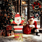 Papá Noel luminoso junto a un árbol de Navidad, regalos y otro Papá Noel sentado