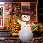 Muñeco de nieve hinchable de 180 cm junto a una casa de ladrillo decorada para Navidad