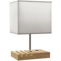 Lámpara de mesa con base de madera, pantalla blanca y puertos USB sobre fondo blanco