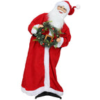 Figura de Papá Noel inclinada con la corona de Navidad, vista en movimiento sobre fondo blanco