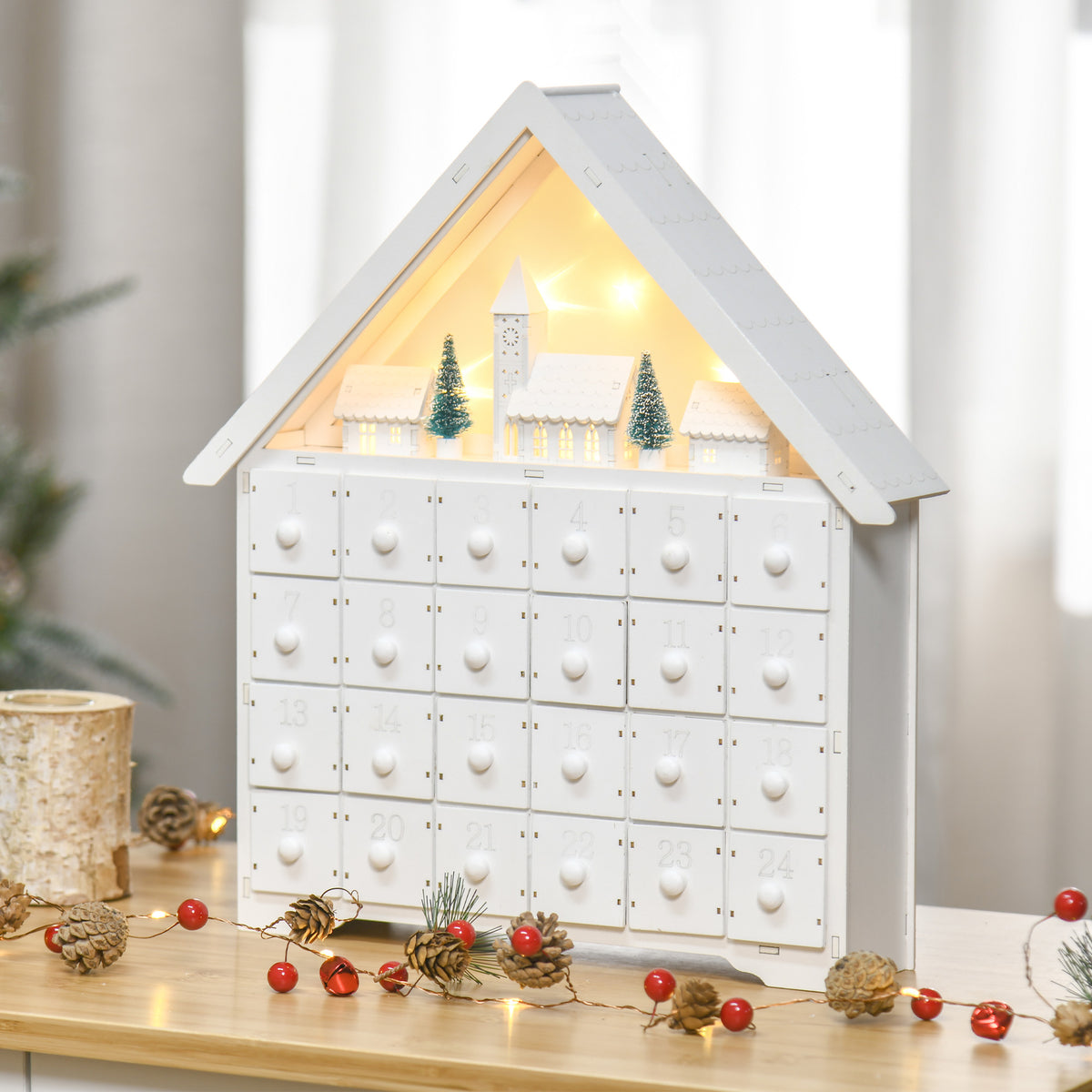 Calendario de Adviento casita con luces LED encendidas