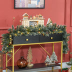 Guirnalda de Navidad luminosa sobre una consola negra y dorada con un pueblo navideño de madera