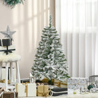Árbol nevado de 120 cm junto a una ventana con regalos y adornos