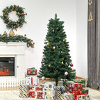 Abeto de Navidad artificial junto a una chimenea con una corona y regalos