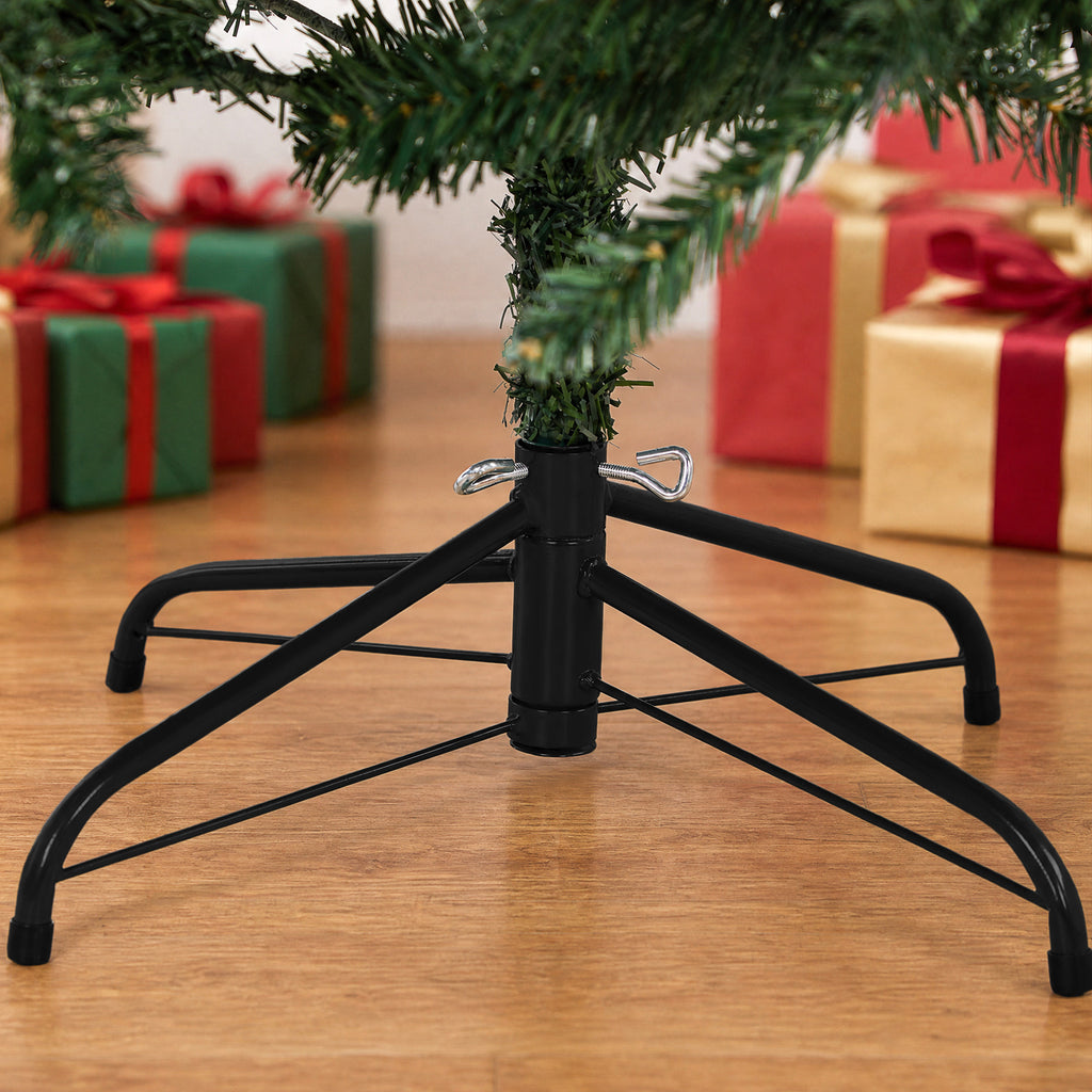 Detalle del soporte de acero del abeto de Navidad sobre el suelo de madera