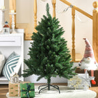 Abeto de Navidad artificial junto a una escalera de madera con regalos y adornos