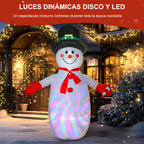 Luces dinámicas disco y LED: muñeco de nieve hinchable iluminado delante de una casa decorada