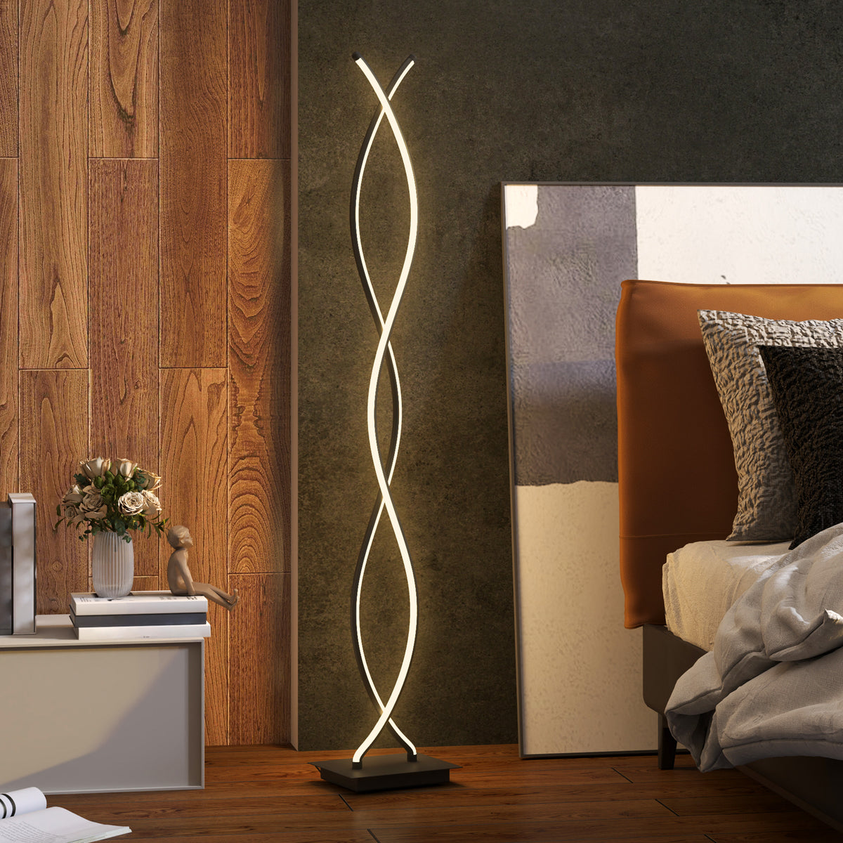 Lámpara de pie LED de doble espiral encendida junto a una cama en un dormitorio