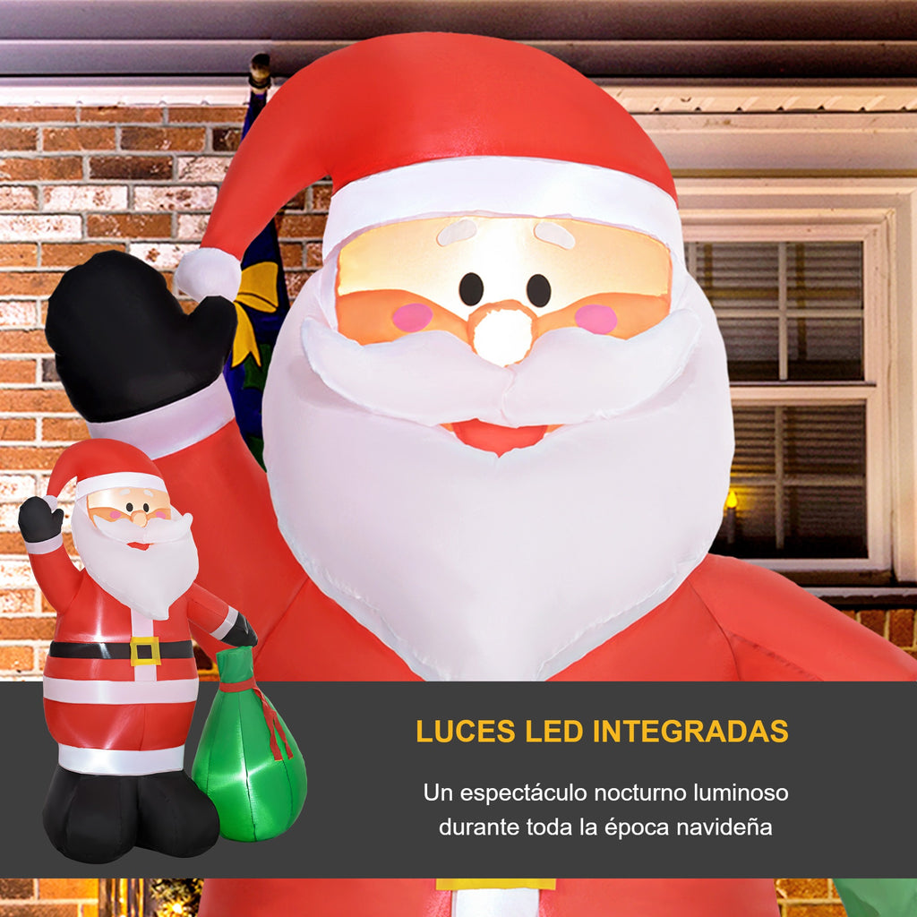 Luces LED integradas: Papá Noel hinchable iluminado por la noche delante de una casa