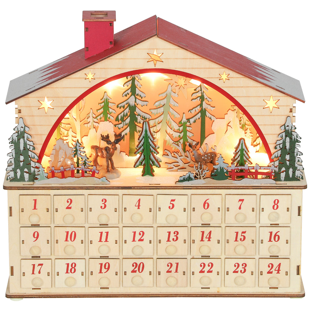 Calendario de Adviento de madera con escena de pueblo y 24 cajones, vista completa sobre fondo blanco